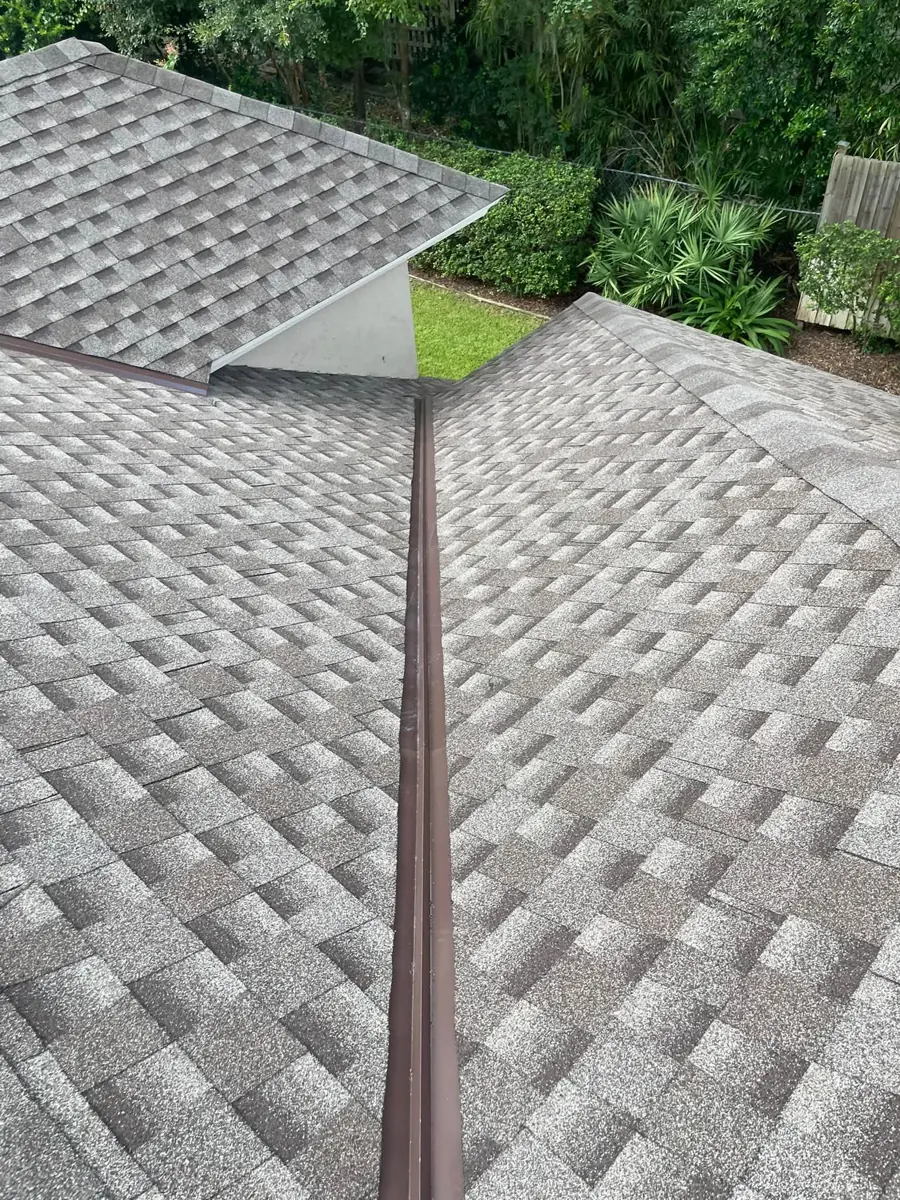 New shingles with brown metal valley flashing